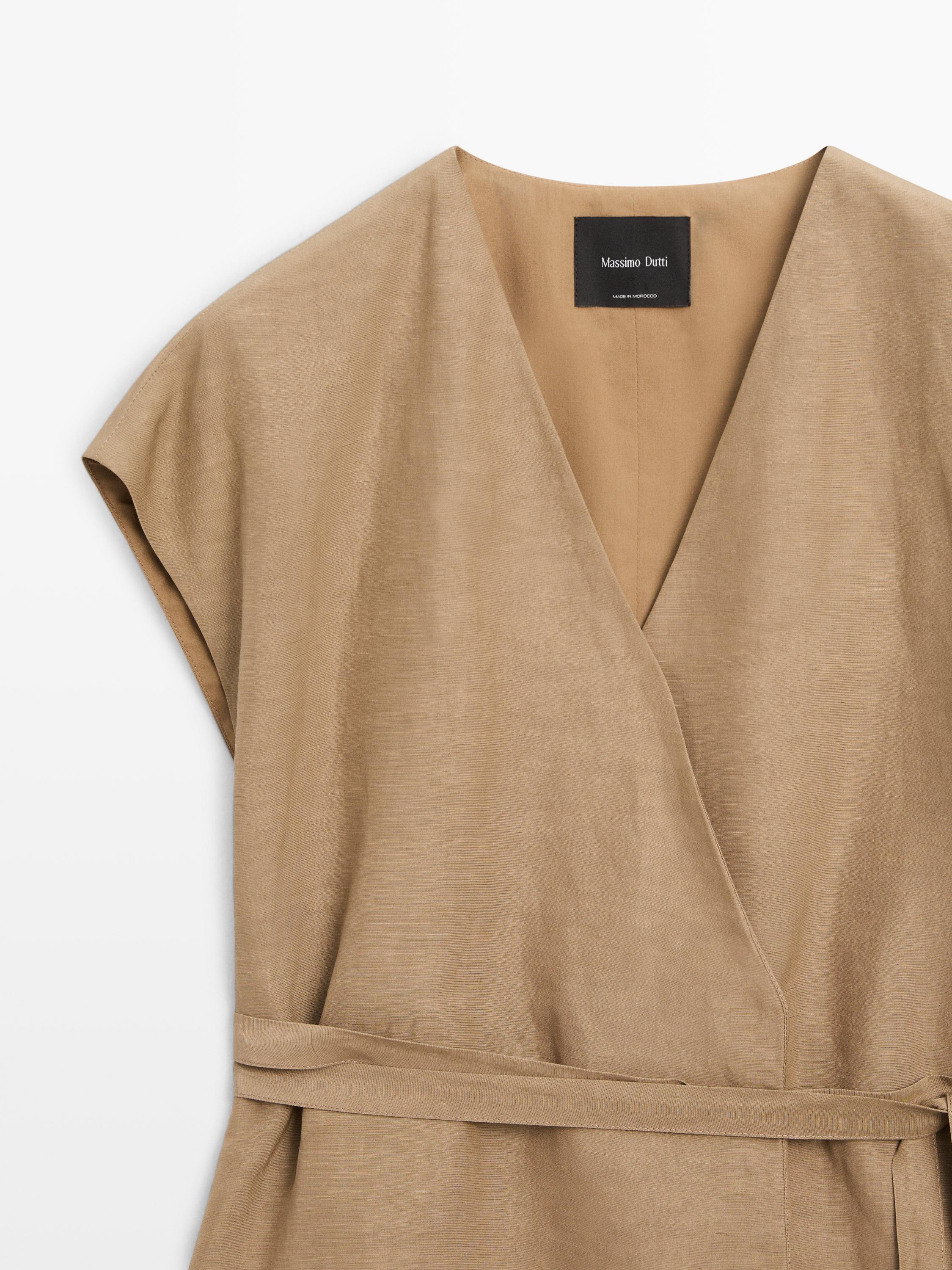 Veste longue cache-cœur sans manches